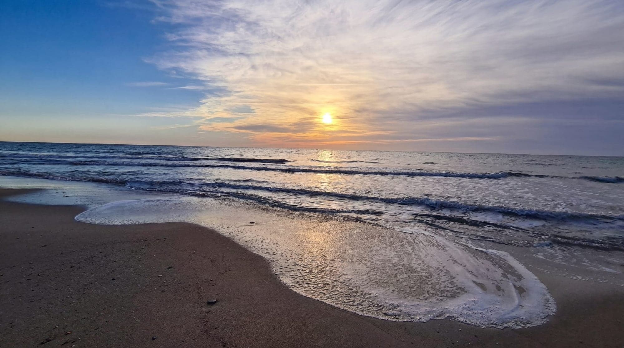 Sunset on the sandy beach a kilometre from the plots